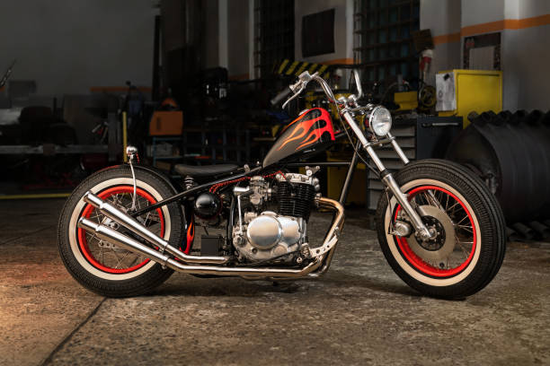 Custom bobber motorbike in an workshop garage. stock photo