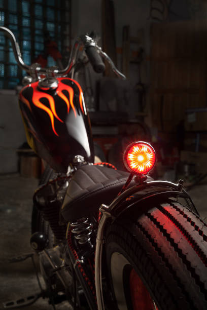 Custom bobber motorbike in an workshop garage. stock photo