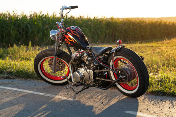 Custom bobber motorbike standing on a road. stock photo