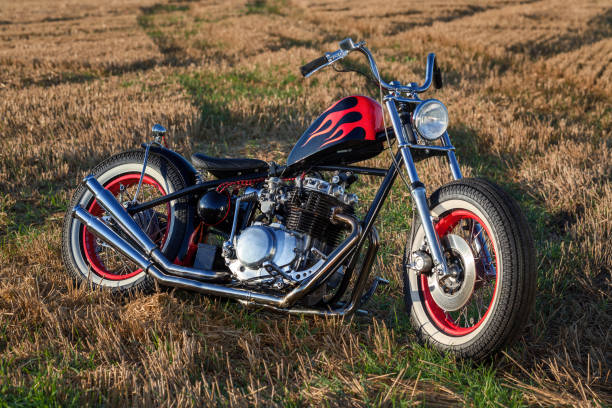 istock Custom bobber motorbike standing in a wheat field. 1280455701