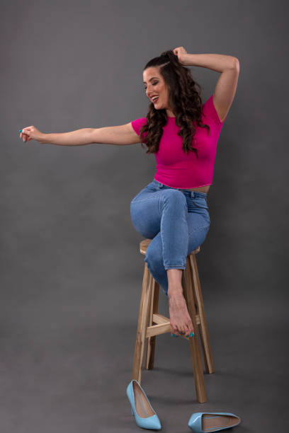 istock Beautiful long dark hair woman posing on studio with grey background 1280455943