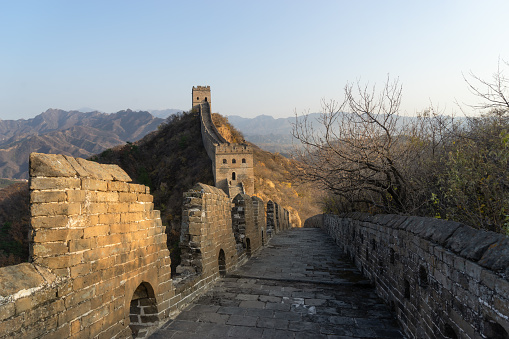 Great Wall of China in the autumn on a background of mountains