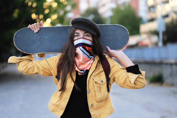 istock Girl going to school with her skateboard 1280458368