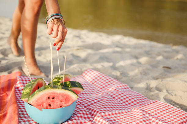 istock Taking a piece of watermelon as a refreshment on the beach 1280459309