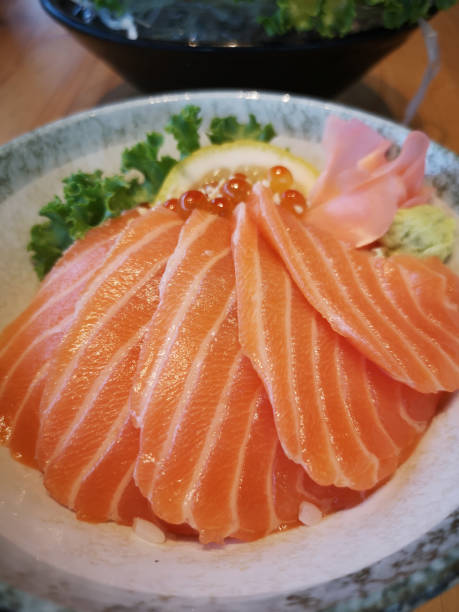 istock Close up slice of salmon sashimi 1280462168