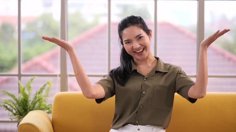 A beautiful woman say I love you very much by sign language