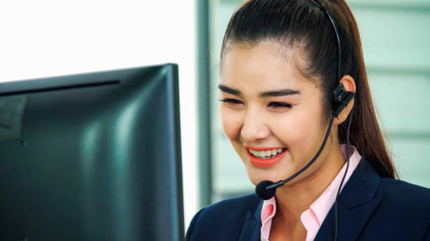 istock Business people wearing headset working in office 1280463651