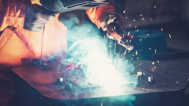 istock Metal welder working with arc welding machine 1280464543