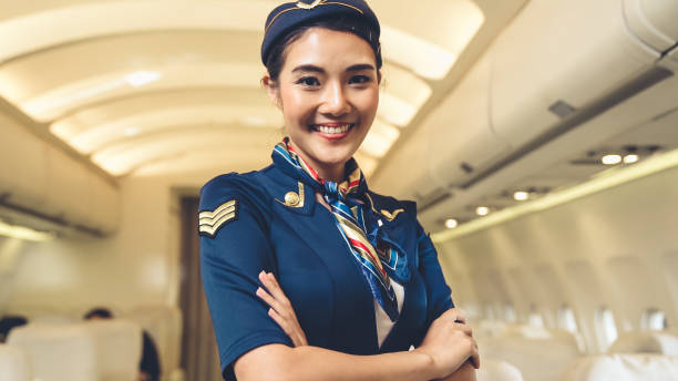 istock Cabin crew or air hostess working in airplane 1280464624