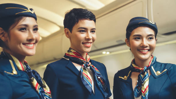 istock Group of cabin crew or air hostess in airplane 1280465626