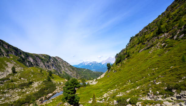 istock Scenic view of mountains against sky 1280466021
