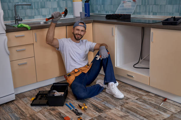 istock Happy young caucasian worker with raised hand holding hammer 1280468128
