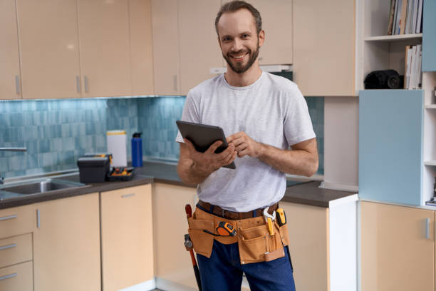istock Young caucasian house master with tablet standing in kitchen 1280468160