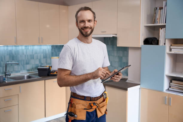 istock Smiling young caucasian male worker with tablet during work in kitchen 1280468184