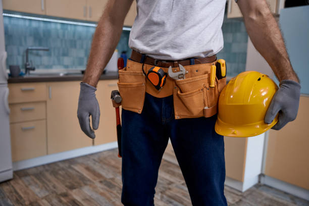 istock Young repairman with tools belt and hard helmet 1280468207