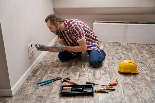 istock Young caucasian electrician putting power socket into wall 1280468302