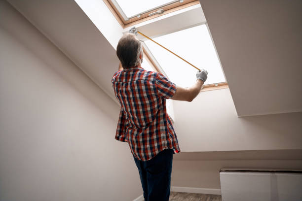 istock Rear view of repairman measuring skylight window 1280468340