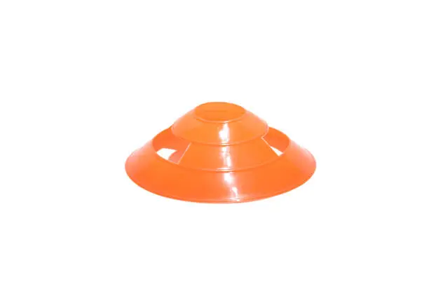 Photo of Orange Training Cone made out of plastic on isolated white background
