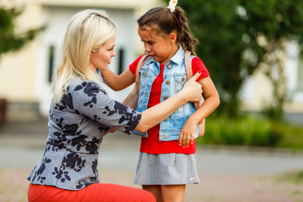 istock teacher consoling a girl on schoolyards 1280470116