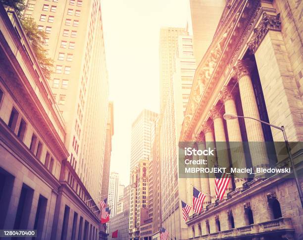Wall Street In New York City At Sunset Usa Stock Photo - Download Image Now - Wall Street - Lower Manhattan, Sunset, Flag