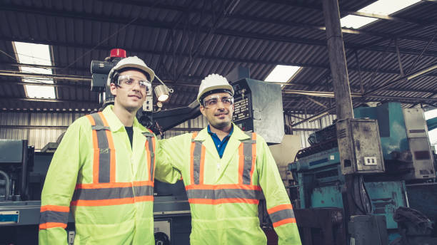istock Group of factory workers using machine equipment in factory workshop 1280470524