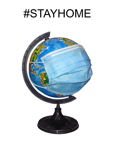 There is a earth globe with a protective mask. Stayhome. White background. Isolated.