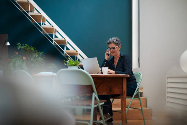 istock One woman staying home working and making a phone call. 1280477500