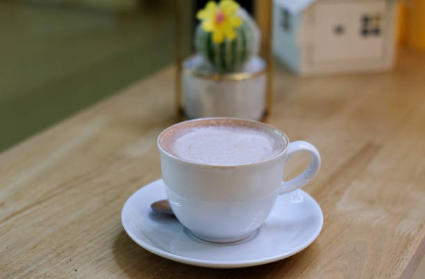 istock Cocoa drink in white mug on brown wooden table 1280483240