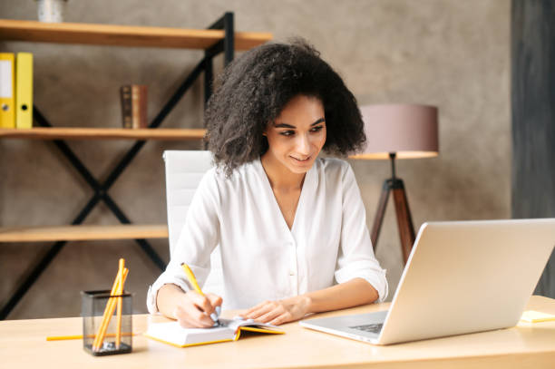 istock A young woman is using laptop at office 1280484836