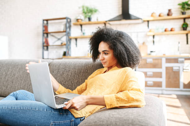 istock young woman is using laptop at home 1280484873