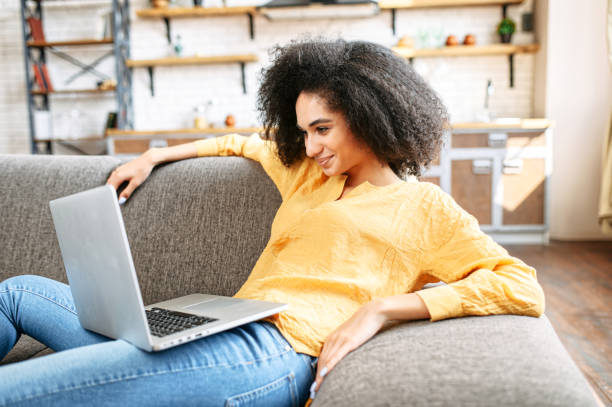 istock young woman is using laptop at home 1280484875