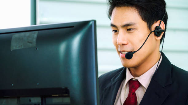 istock Business people wearing headset working in office 1280485988