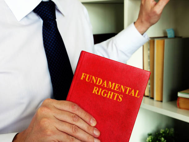 istock Lawyer offers a book fundamental rights. 1280488882