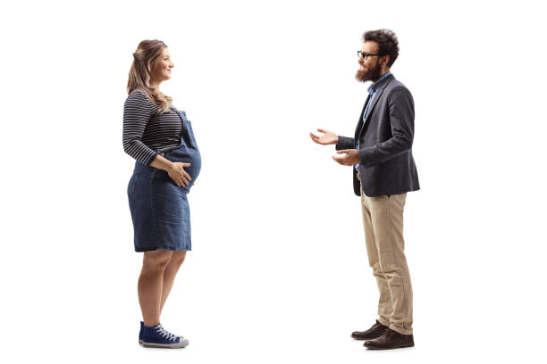 istock Pregnant woman and a bearded man having a conversation 1280489650