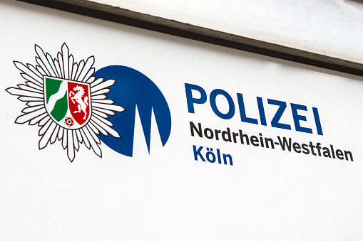 Cologne, Germany - February 20th 2020: The official logo of Polizei Nordrhein-Westfalen Koln, or the Police of the North Rhine-Westphalia area in Cologne, Germany.
