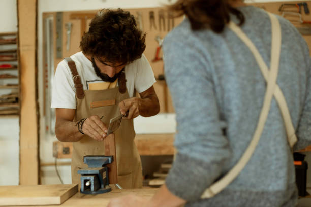 istock business woman working as carpenter in a small carpentry workshop. 1280491300