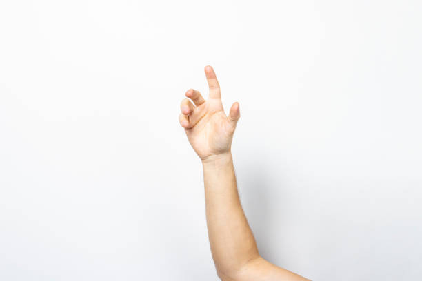 istock empty male hand holding palm up. Man's hand holding an invisible object on a light background. Hand gesture 1280492355