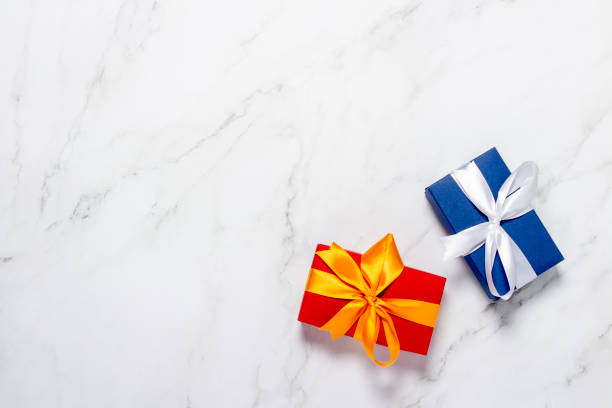 istock Gift boxes on a marble background. Holiday concept, presents. Flat lay, top view 1280493928