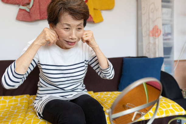 istock Senior woman training face muscle 1280496745