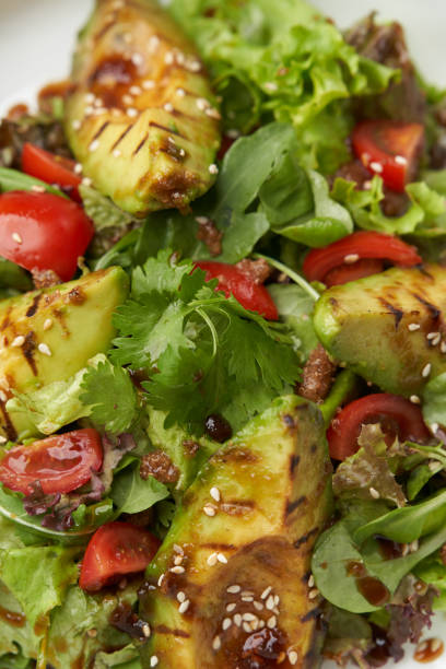 istock Avocado salad with fresh leaves and vegetable 1280497055