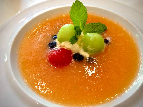 tropical chilled fruit soup topped with creme fraiche - creme fraiche imagens e fotografias de stock