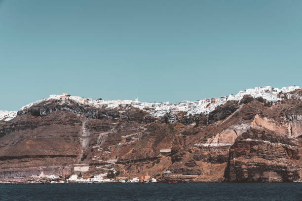 istock View of Santorini cliffside shore from the sea 1280501191