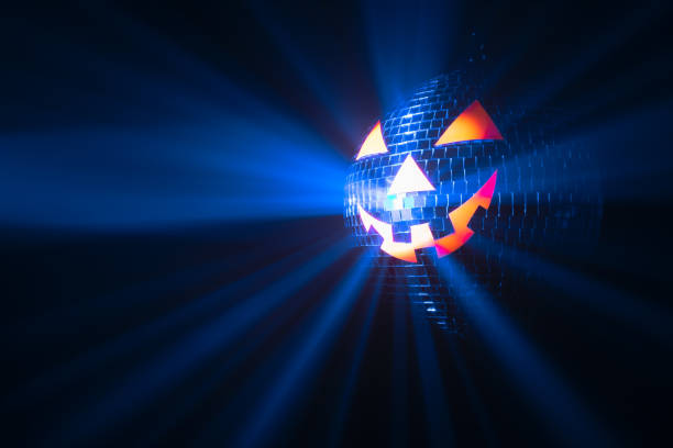 istock Halloween party pumpkin disco ball, jack-o-lantern with shiny rays in smoke 1280501956