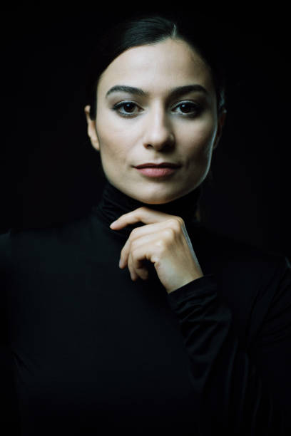 istock young woman wearing turtleneck smiling at camera 1280506923