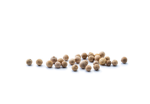 White peppercorns,  isolated on a white background, low angle view. Close-up.