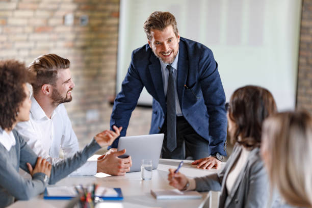 istock Happy CEO talking to his team on a meeting in the office. 1280509093