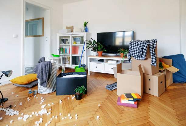 istock Boxes and personal things on the floor, moving into the new apartment 1280509722
