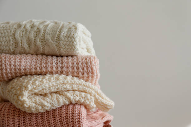 istock Bunch of autumnal knitted clothes. 1280511651