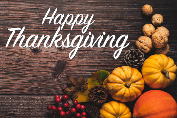 istock Happy Thanksgiving Day with pumpkin and nut on wooden table 1280515002