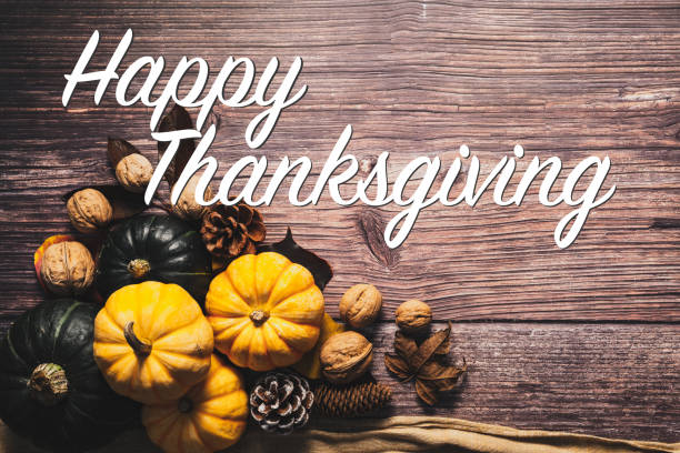 istock Happy Thanksgiving Day with pumpkin and nut on wooden table 1280515005